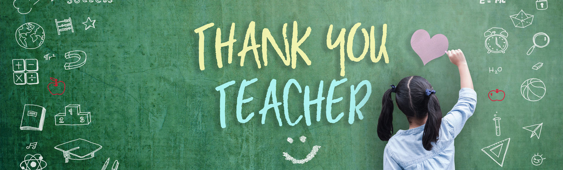 Image showing a girl writing "Thank you teacher" on a large chalkboard