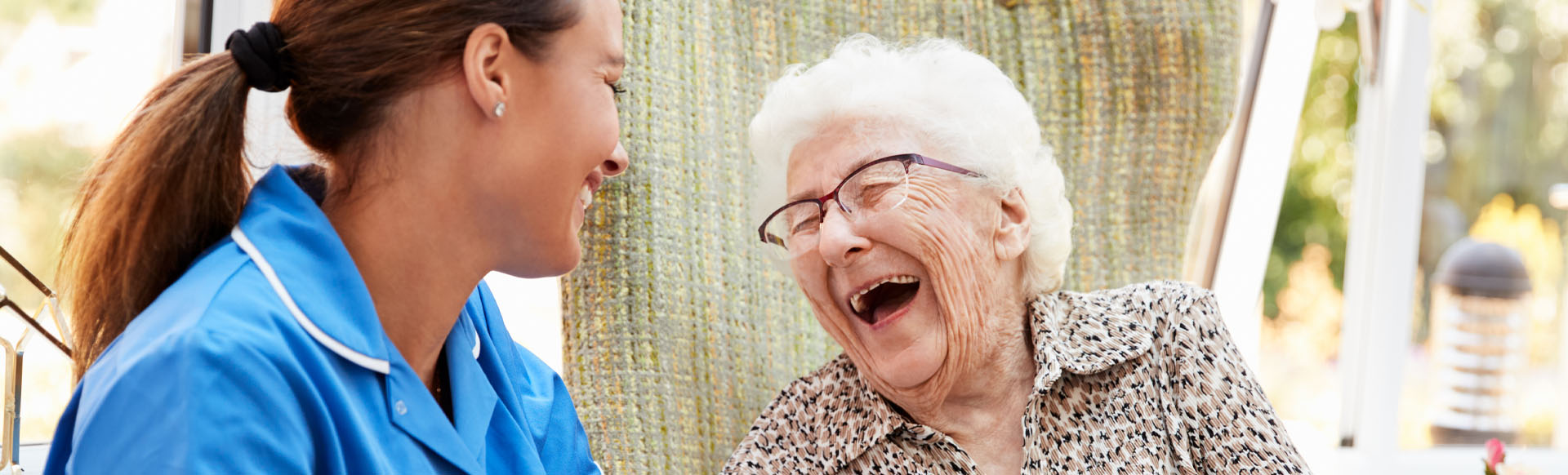 Image showing a nurse laughing with an elderly patient
