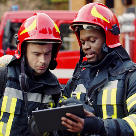 Image showing two firefighters looking at a tablet together