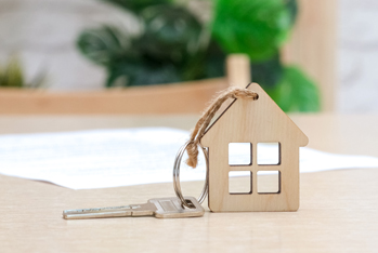 Image showing a house made of wood and a key