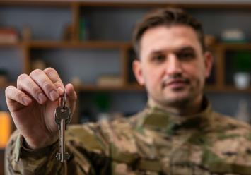 Image showing a soldier holding house keys