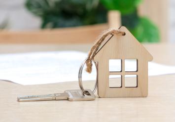 Image showing a house made of wood and a key