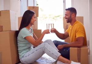 one couple is cheering near boxes