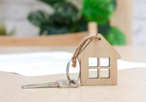 Image showing a house made of wood and a key